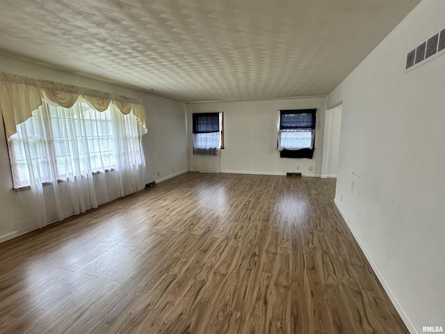 2401 Springfield Rd, East Peoria, IL 61611 - spare room featuring wood finished floors