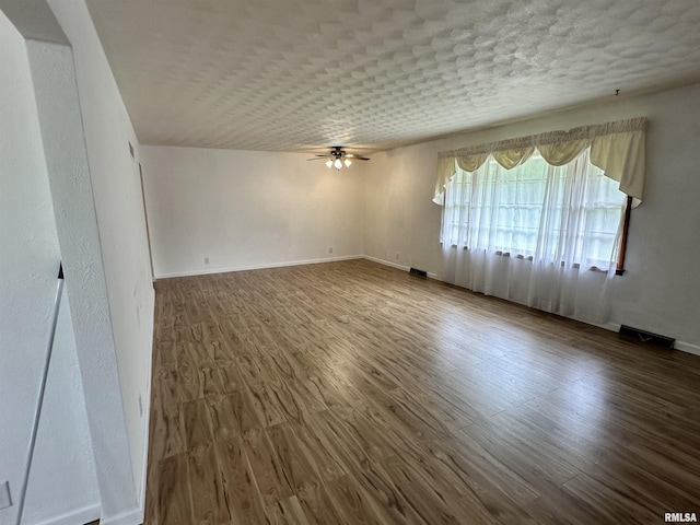 2401 Springfield Rd, East Peoria, IL 61611 - empty room featuring a ceiling fan and wood finished floors