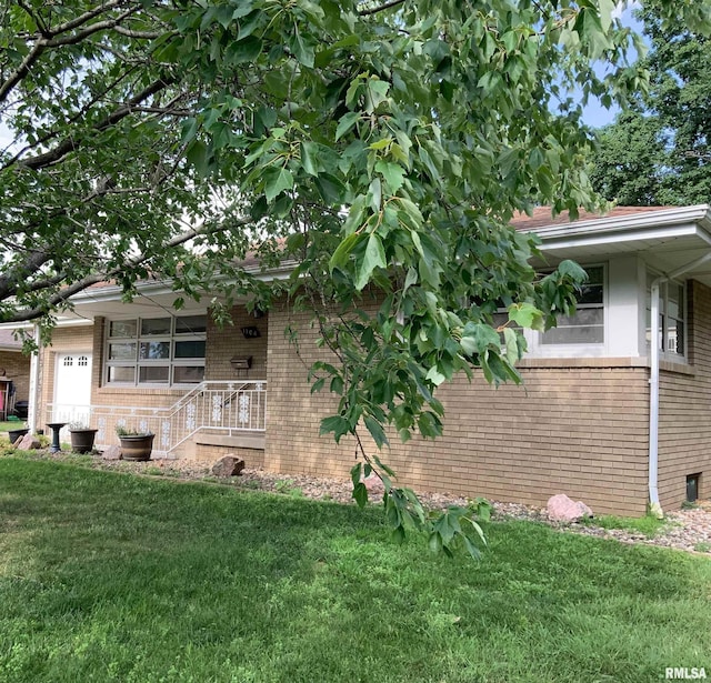 1104 S 8th St, Pekin, IL 61554 - view of side of property featuring brick siding and a lawn