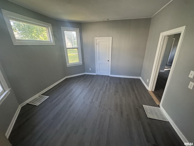 512 Fairholm Ave, Peoria, IL 61603 - spare room with dark wood-style flooring and baseboards