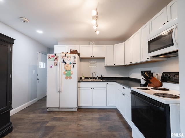 1600 W Willcox Ave, Peoria, IL 61604 - kitchen with white appliances, dark wood-style floors, white cabinetry, and dark countertops