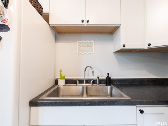 1600 W Willcox Ave, Peoria, IL 61604 - kitchen with dark countertops and white cabinets