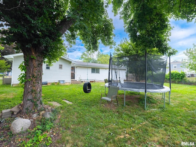 1600 W Willcox Ave, Peoria, IL 61604 - view of yard featuring a trampoline and entry steps