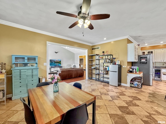 11801 N Deerfield Dr, Dunlap, IL 61525 - dining room with crown molding, ceiling fan, wine cooler, and recessed lighting