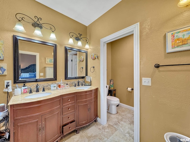 11801 N Deerfield Dr, Dunlap, IL 61525 - full bathroom featuring toilet and double vanity