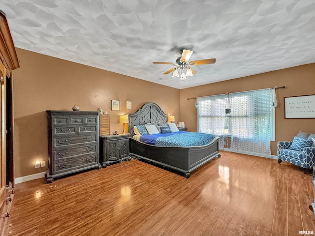 11801 N Deerfield Dr, Dunlap, IL 61525 - bedroom with wood finished floors and a ceiling fan