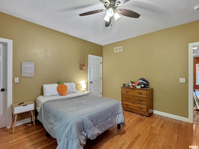 11801 N Deerfield Dr, Dunlap, IL 61525 - bedroom featuring light wood-style flooring and a ceiling fan