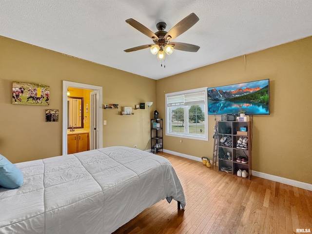11801 N Deerfield Dr, Dunlap, IL 61525 - bedroom with wood-type flooring, a ceiling fan, and a textured ceiling