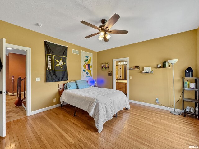 11801 N Deerfield Dr, Dunlap, IL 61525 - bedroom featuring light wood finished floors, a ceiling fan, and connected bathroom