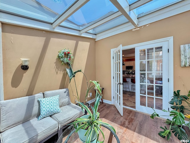 11801 N Deerfield Dr, Dunlap, IL 61525 - sunroom with a skylight, wood finished floors, healthy amount of natural light, and lofted ceiling