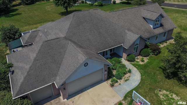 11801 N Deerfield Dr, Dunlap, IL 61525 - view of side of home with a lawn, brick siding, and roof with shingles