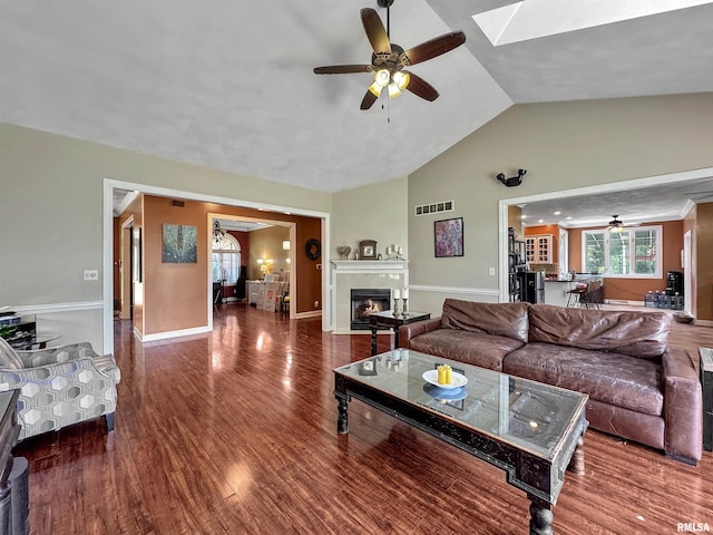 11801 N Deerfield Dr, Dunlap, IL 61525 - living area with a ceiling fan, a fireplace, wood finished floors, high vaulted ceiling, and a skylight
