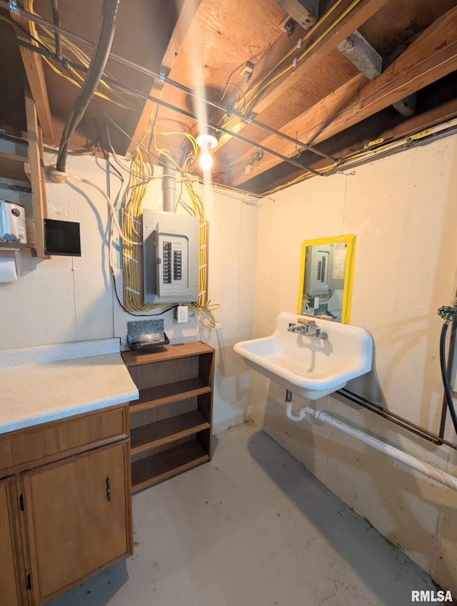 1427 Matilda St, Pekin, IL 61554 - unfinished below grade area featuring electric panel and a sink