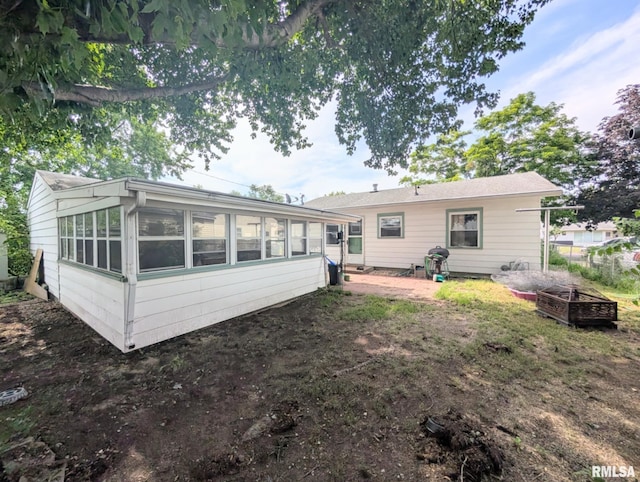 1427 Matilda St, Pekin, IL 61554 - back of property with a sunroom