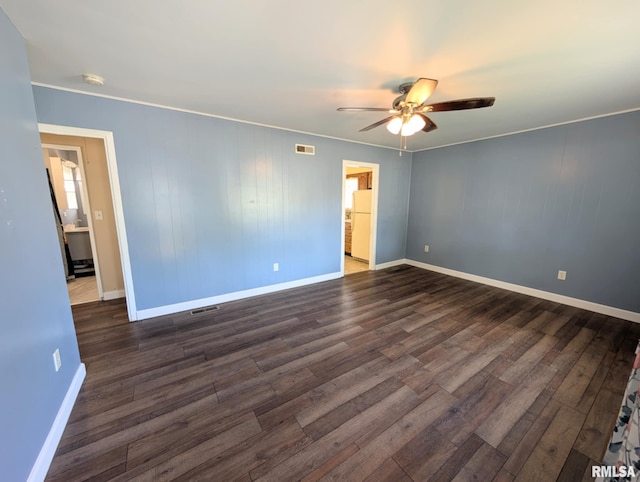 1427 Matilda St, Pekin, IL 61554 - unfurnished room featuring dark wood-style flooring, ceiling fan, a smoke detector, and ornamental molding