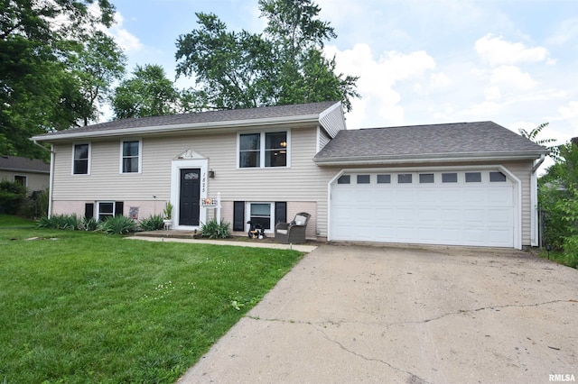 1825 Holiday Dr, Pekin, IL 61554 - split foyer home featuring a front lawn, a garage, driveway, and brick siding