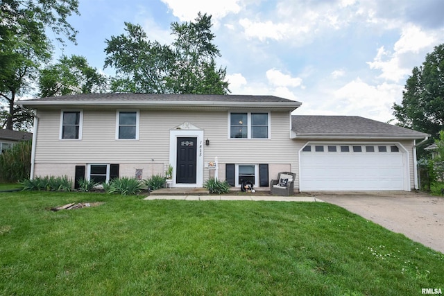 1825 Holiday Dr, Pekin, IL 61554 - bi-level home with an attached garage, a front yard, and concrete driveway