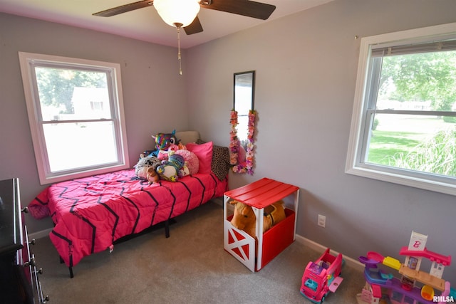 1825 Holiday Dr, Pekin, IL 61554 - carpeted bedroom with multiple windows and ceiling fan