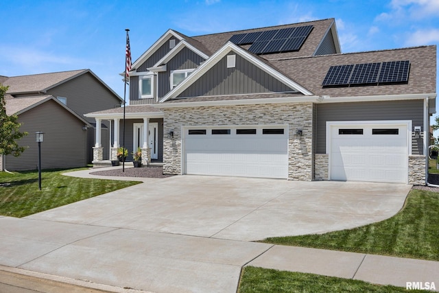 2821 W Lake Trail Ct, Dunlap, IL 61525 - craftsman inspired home featuring board and batten siding, an attached garage, concrete driveway, a shingled roof, and stone siding
