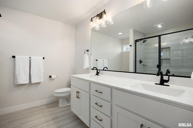 2821 W Lake Trail Ct, Dunlap, IL 61525 - bathroom with double vanity, a stall shower, and wood finished floors