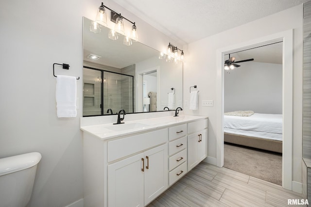 2821 W Lake Trail Ct, Dunlap, IL 61525 - ensuite bathroom with double vanity, ceiling fan, and a shower stall