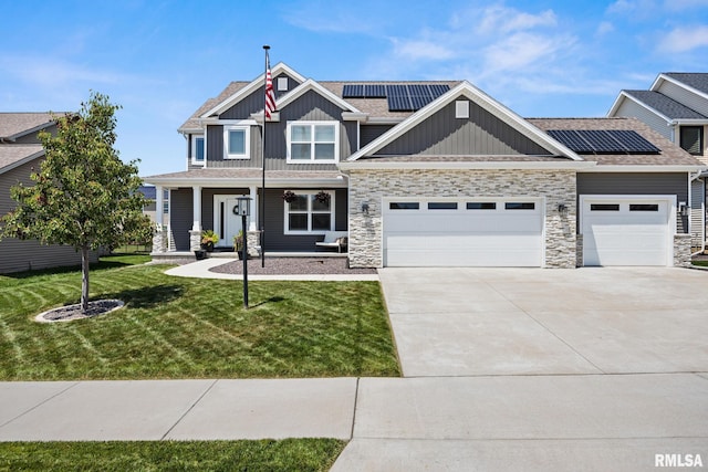 2821 W Lake Trail Ct, Dunlap, IL 61525 - craftsman house featuring board and batten siding, concrete driveway, a garage, and stone siding