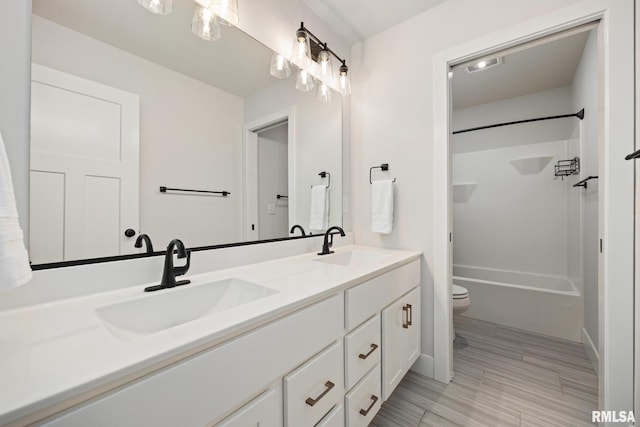 2821 W Lake Trail Ct, Dunlap, IL 61525 - bathroom with double vanity and bathing tub / shower combination
