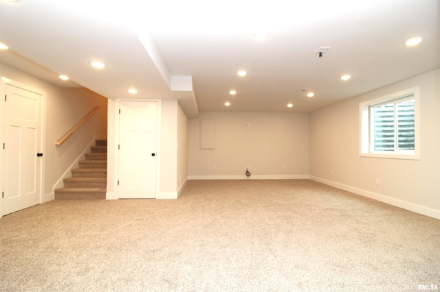 2821 W Lake Trail Ct, Dunlap, IL 61525 - below grade area featuring light carpet, recessed lighting, and stairs