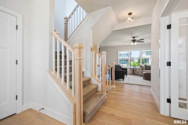 2821 W Lake Trail Ct, Dunlap, IL 61525 - stairway with ceiling fan and wood finished floors