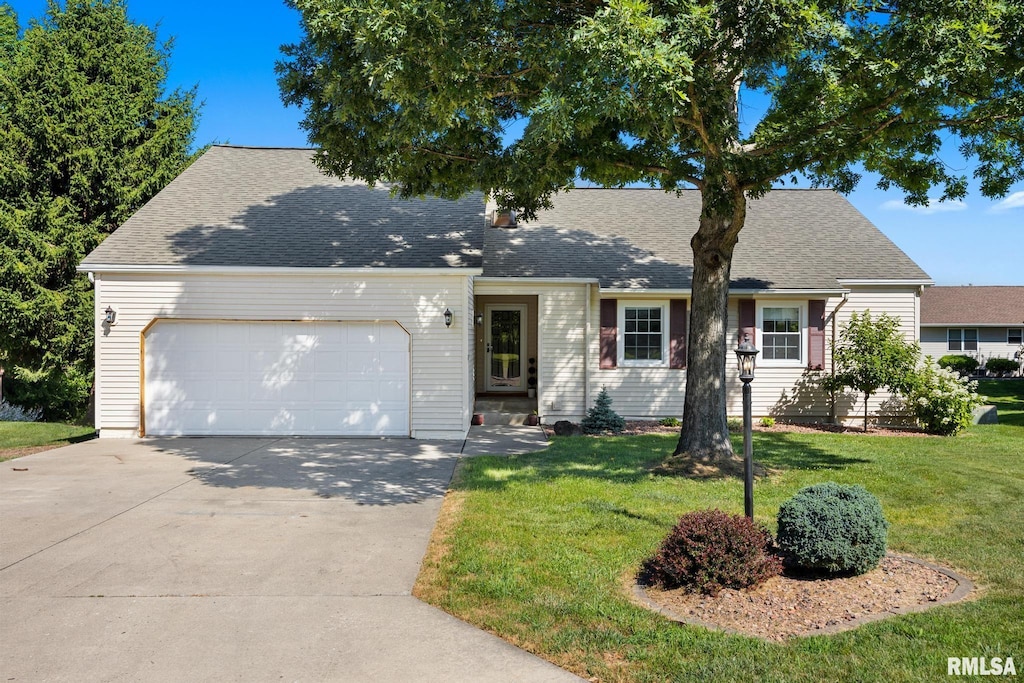 30 Country Ln, East Peoria, IL 61611 - view of front of property with a garage, a front yard, driveway, and roof with shingles