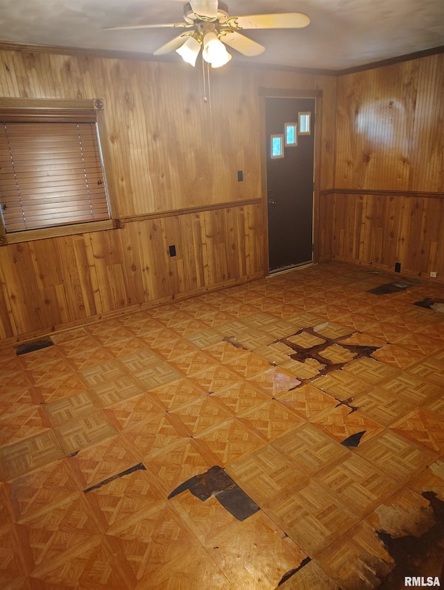 1340 E Ash St, Canton, IL 61520 - unfurnished room featuring wooden walls and a ceiling fan