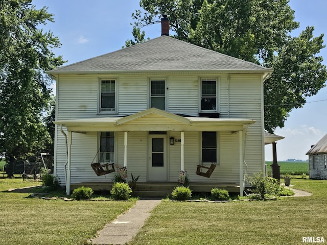 1469 2100th St, Lincoln, IL 62656 - traditional style home featuring covered porch, a chimney, a front yard, and roof with shingles