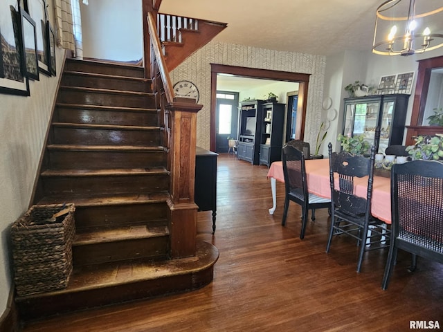 1469 2100th St, Lincoln, IL 62656 - dining area featuring dark wood-style floors, a chandelier, stairs, and wallpapered walls