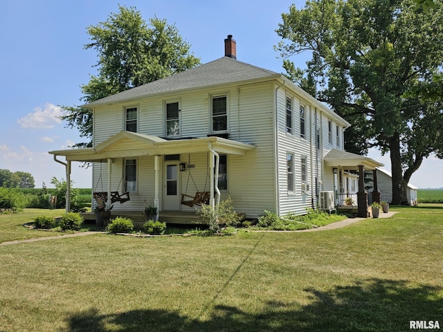 1469 2100th St, Lincoln, IL 62656 - view of front facade featuring a porch, a chimney, and a front lawn