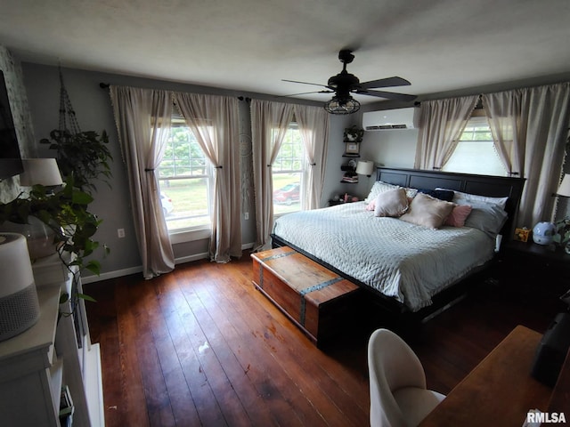 1469 2100th St, Lincoln, IL 62656 - bedroom featuring a wall mounted AC, dark wood-style flooring, and ceiling fan