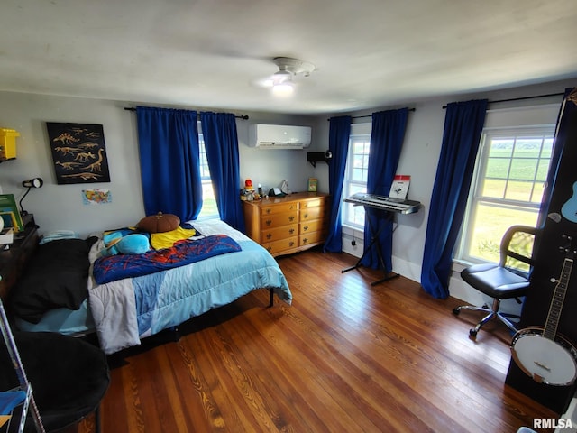 1469 2100th St, Lincoln, IL 62656 - bedroom featuring a wall mounted air conditioner, wood finished floors, and multiple windows