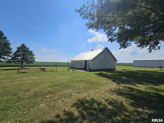 1469 2100th St, Lincoln, IL 62656 - view of grassy yard with a pole building, an outdoor structure, and a rural view