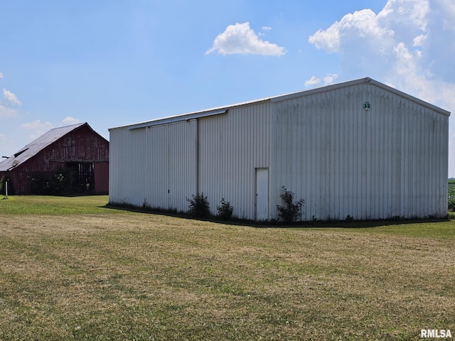 1469 2100th St, Lincoln, IL 62656 - view of pole building featuring a lawn