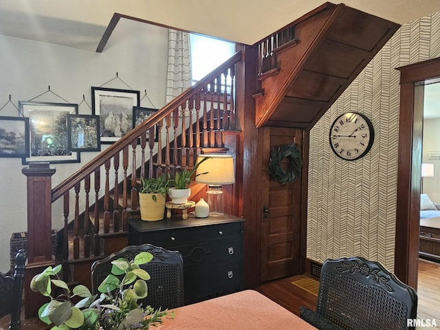 1469 2100th St, Lincoln, IL 62656 - staircase with wood finished floors and wallpapered walls
