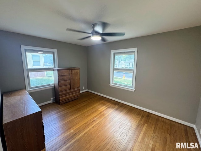 4107 N Hollyridge Cir, Peoria, IL 61614 - unfurnished bedroom with hardwood / wood-style flooring and a ceiling fan