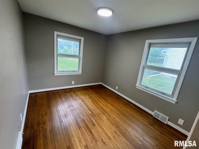 4107 N Hollyridge Cir, Peoria, IL 61614 - empty room with hardwood / wood-style floors and baseboards