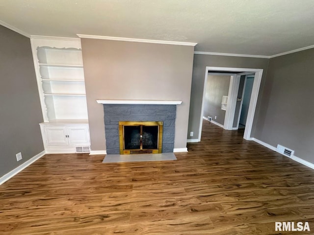 4107 N Hollyridge Cir, Peoria, IL 61614 - unfurnished living room featuring wood finished floors, a fireplace with flush hearth, crown molding, and built in shelves