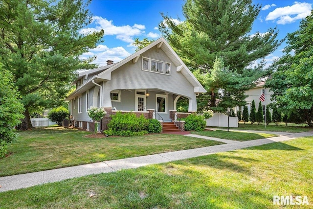 213 S Hanover St, Metamora, IL 61548 - view of front of house featuring a porch, a chimney, and brick siding
