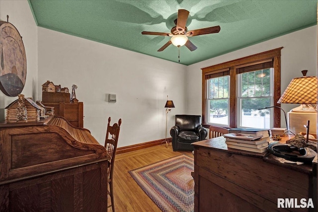 213 S Hanover St, Metamora, IL 61548 - home office with a ceiling fan and light wood-style floors