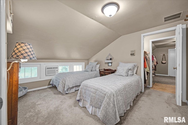 213 S Hanover St, Metamora, IL 61548 - bedroom with light colored carpet, lofted ceiling, and a wall mounted AC