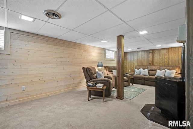 213 S Hanover St, Metamora, IL 61548 - living room featuring carpet flooring, wood walls, and a drop ceiling