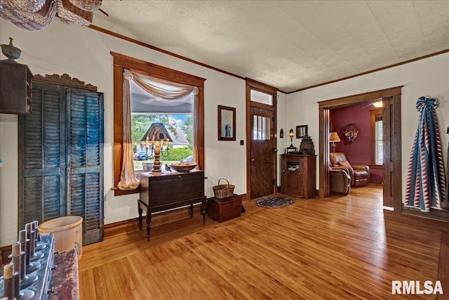 213 S Hanover St, Metamora, IL 61548 - entryway featuring hardwood / wood-style floors and ornamental molding