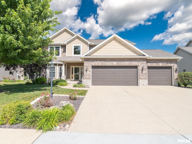 11014 N Saddlehorn Way, Dunlap, IL 61525 - craftsman-style home with an attached garage, concrete driveway, a front lawn, and brick siding