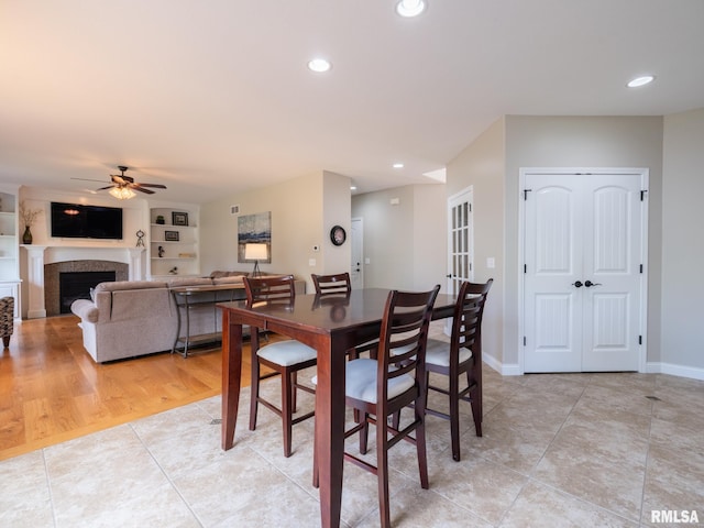 11014 N Saddlehorn Way, Dunlap, IL 61525 - dining room with light tile patterned flooring, ceiling fan, recessed lighting, and a fireplace