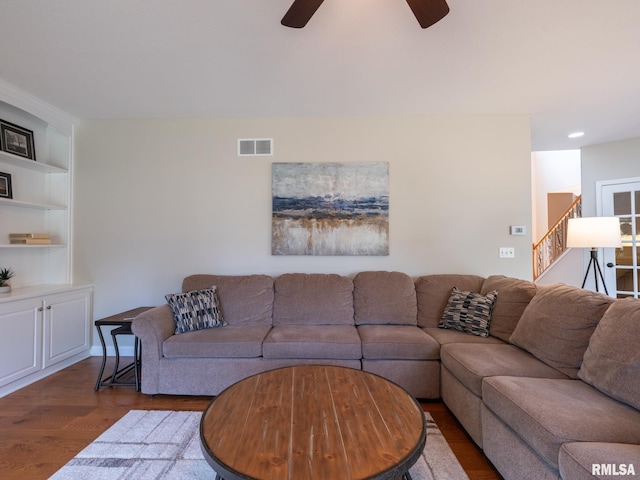 11014 N Saddlehorn Way, Dunlap, IL 61525 - living area with a ceiling fan, dark wood-style flooring, stairs, built in shelves, and recessed lighting